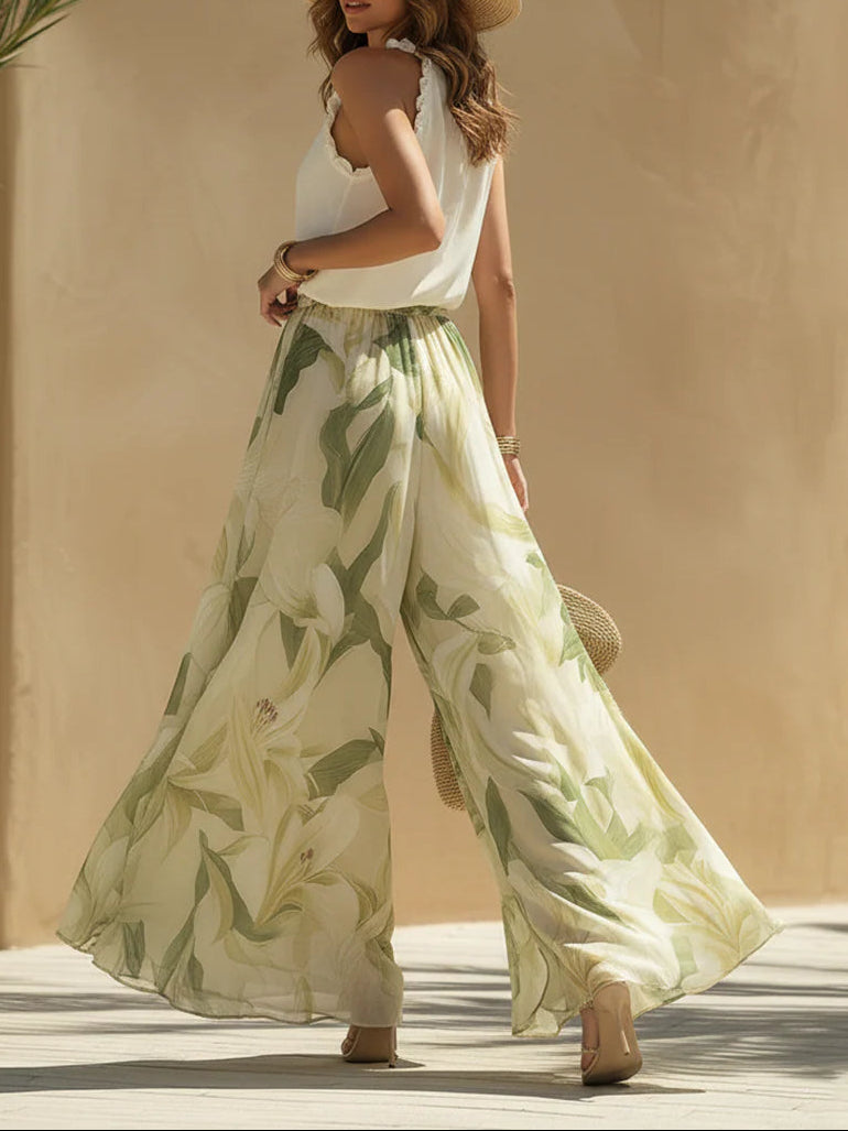 Alessandra - Top senza maniche in chiffon con volant e pantaloni con stampa di gigli