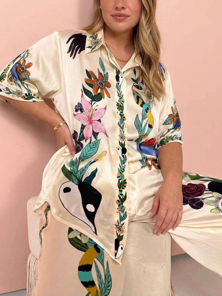 Nika | Set di camicia e pantaloni in satin con stampa unica Vibes Resort