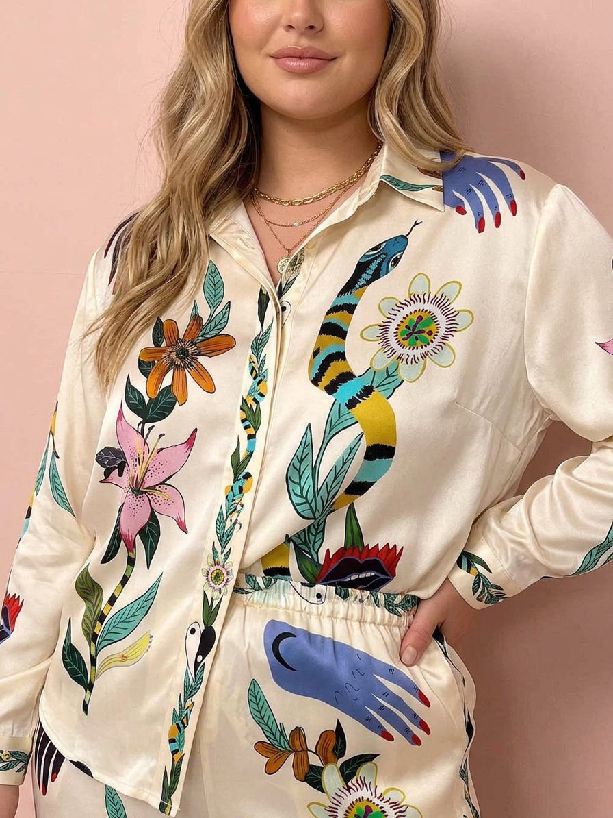 Nika | Set di camicia e pantaloni in satin con stampa unica Vibes Resort