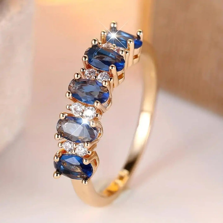Anello a Fascia con Accenti Ovali Alternati