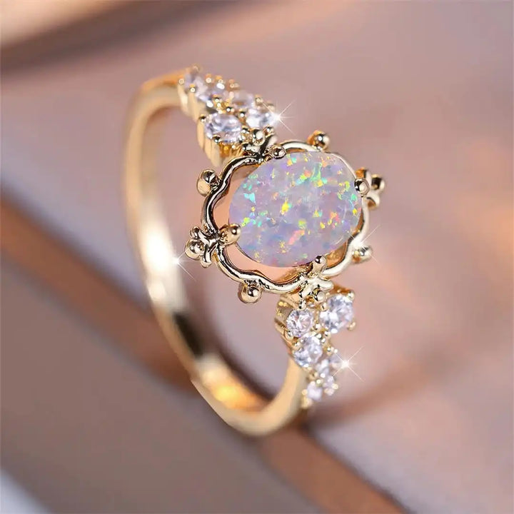 Anello Fiore con Pietra Ovale di Opale Bianco