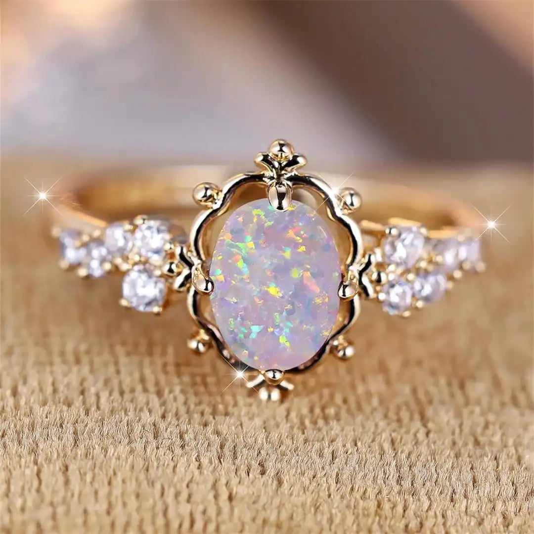 Anello Fiore con Pietra Ovale di Opale Bianco
