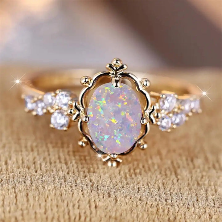 Anello Fiore con Pietra Ovale di Opale Bianco