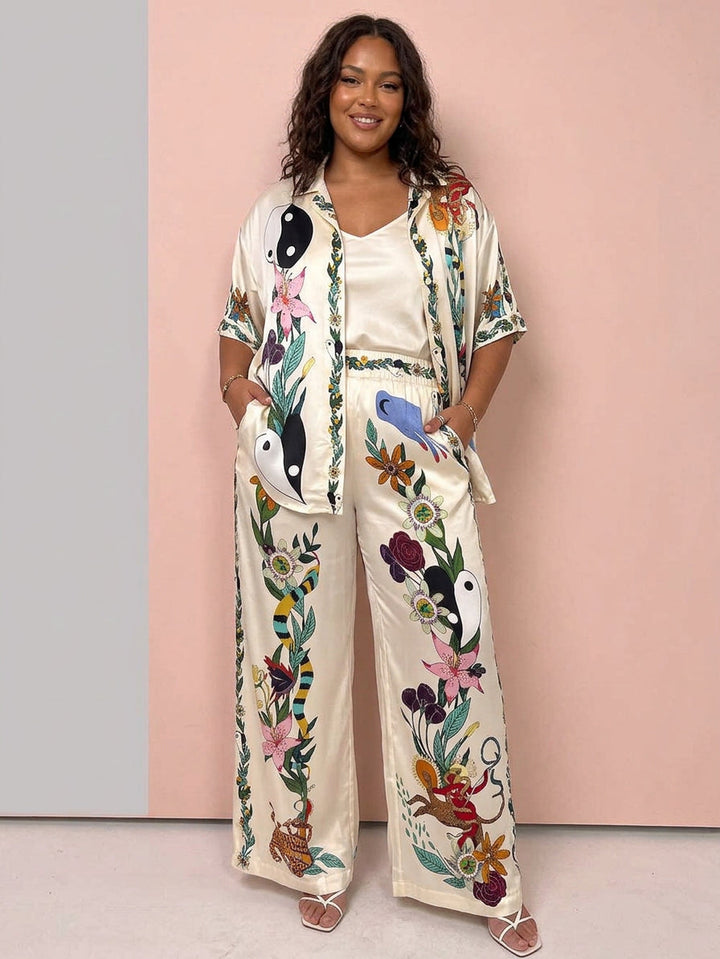 Nika | Set di camicia e pantaloni in satin con stampa unica Vibes Resort