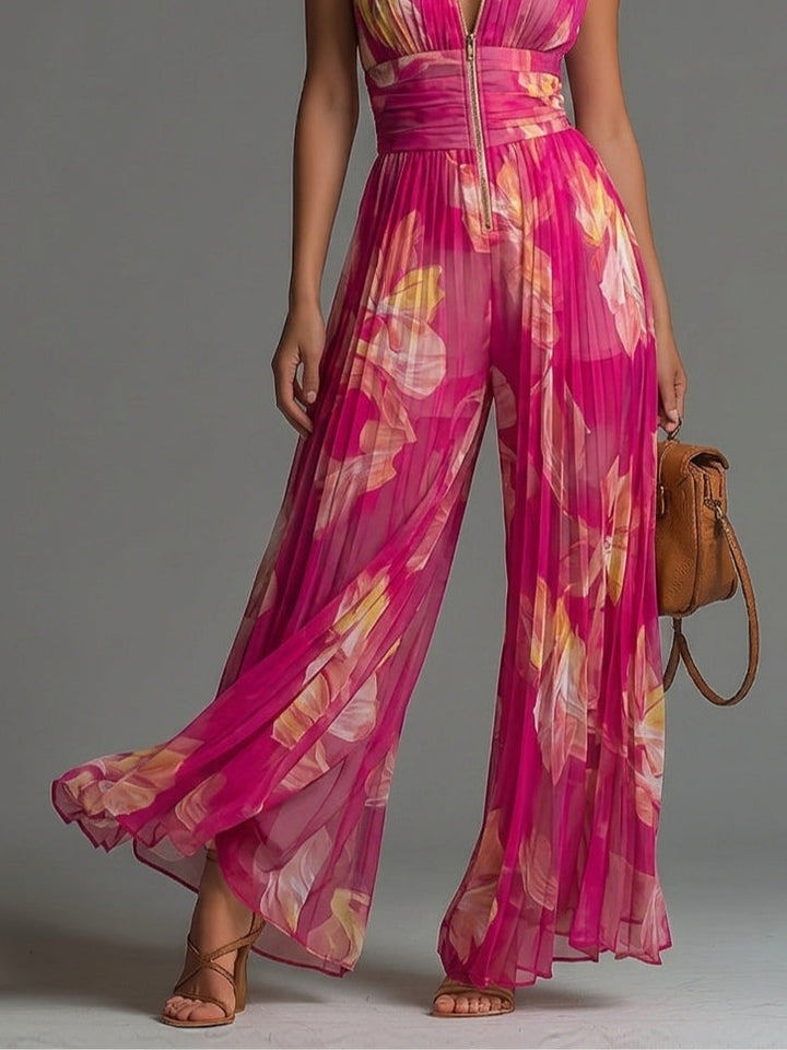 Tuta senza maniche a zip plissettata in chiffon con stampa floreale fucsia