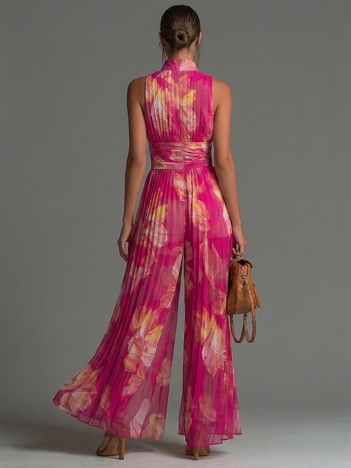 Tuta senza maniche a zip plissettata in chiffon con stampa floreale fucsia