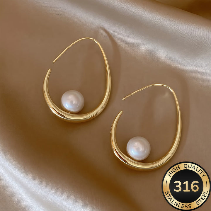 Orecchini a cerchio con perla crescent