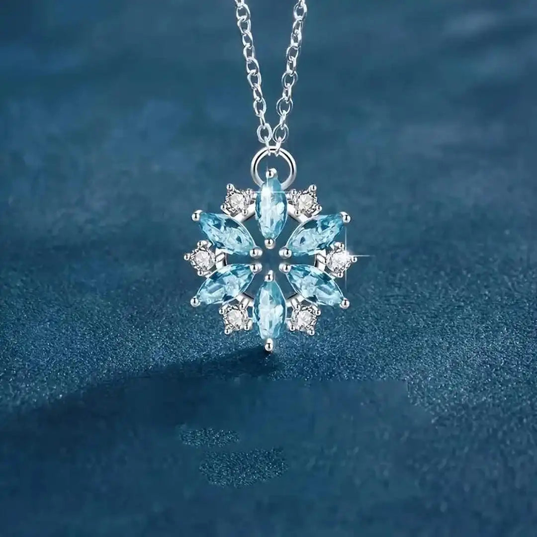 Pendente a Fiore in Oro Bianco con Fiocco di Neve Blu